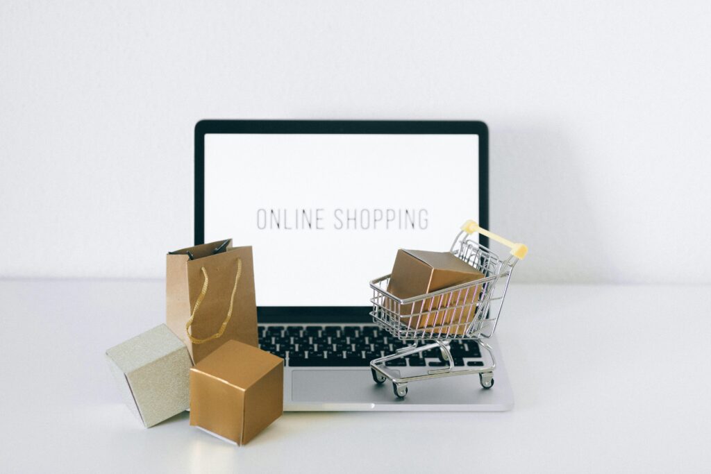 Brown Cardboard Box on Stainless Steel Shopping Cart